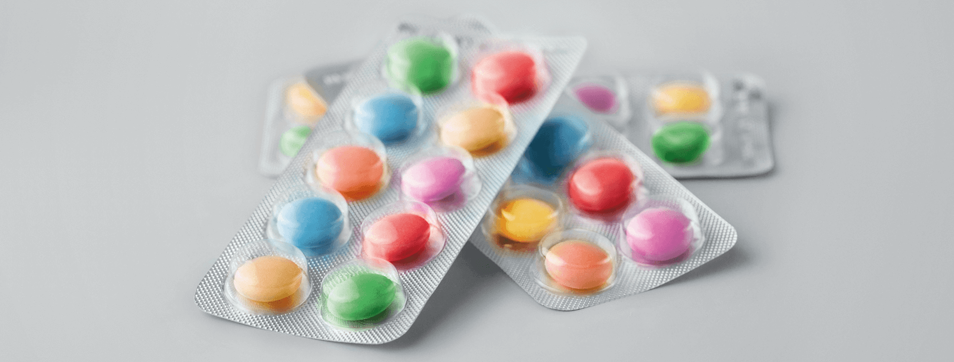 Child-resistant packaging colorful pills in a blister